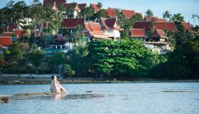 Tourist relaxing on the lake in front of the Temples, Thailand